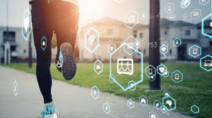 A woman running, seen from behind, with technological icons 