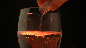 glass into which a substance is poured from a vial