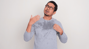 man looking up and sweating