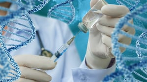 doctor-with-a-syringe-and-a-vaccine-on-the-background-of-dna