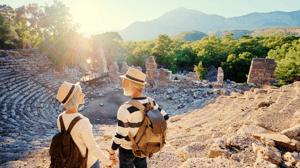Senior family couple enjoying view together on ancient amphitheater.